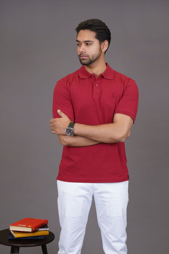 Detail of maroon polo collar and logo stitching