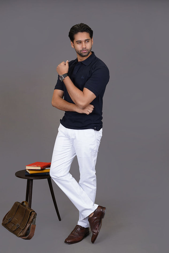 Navy polo shirt styled for smart casual look
