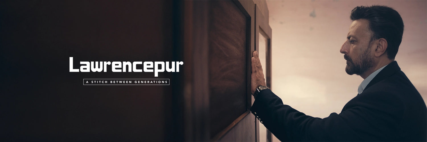 Son touching his father's wardrobe, highlighting Lawrencepur’s heritage and traditional craftsmanship passed down through generations