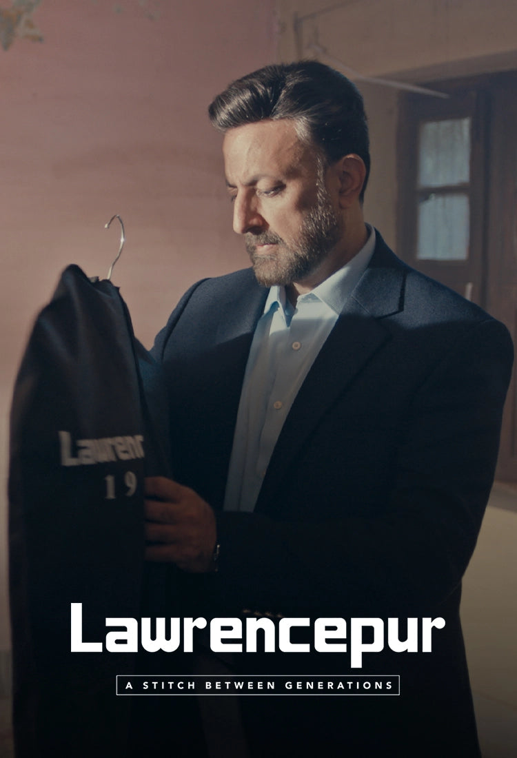 Son feeling his father’s touch on an old Lawrencepur coat, showing heritage and craftsmanship.